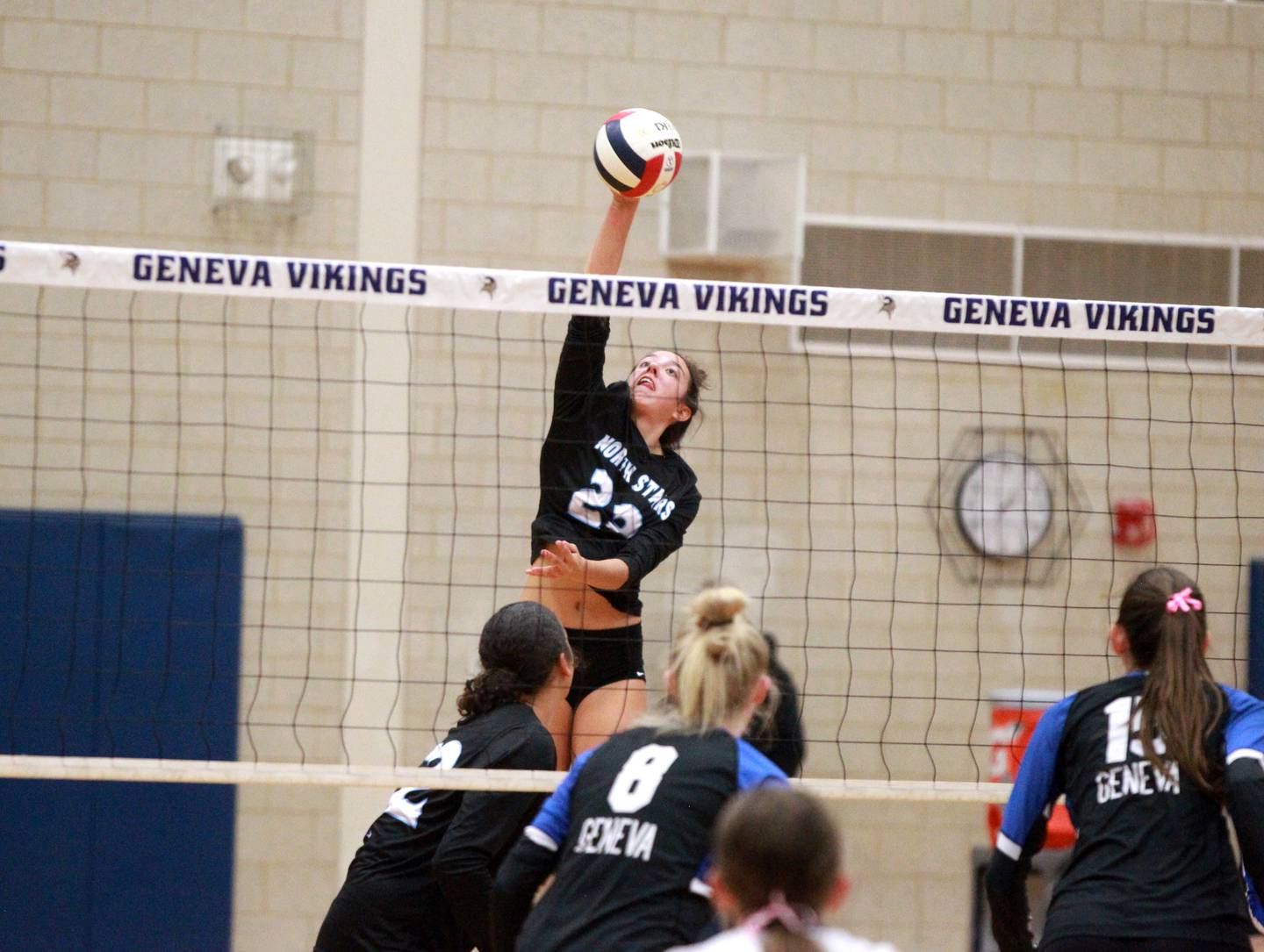 St. Charles North’s Haley Burgdorf goes up for a kill during a game on Tuesday, Oct. 22, 2024 at Geneva.