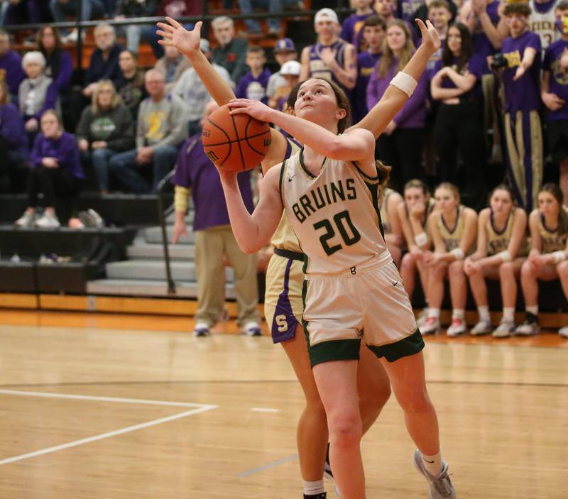 St. Bede's Lili McClain runs in for a layup past Serena's Paisley Twait during the Class 1A Sectional final game on Thursday, Feb. 22, 2024 at Gardner-South Wilmington High School.