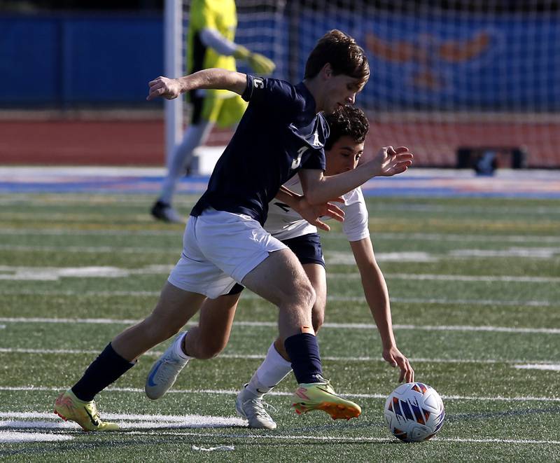 Belleville Althoff Catholic's Jack Sorgea battles with Lemont's Luciano Mancini for control of the ball during an IHSA Class 3A state semifinal soccer match on Friday, Nov. 8, 2024, at Hoffman Estates High School.