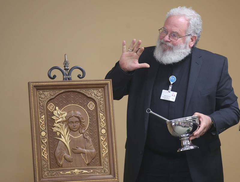 Deacon George Schramn blesses Holy Water on a photo of Saint Maria Goretti during a blessing event of the new OSF Resilient Healing care program that will represent hope, healing and a renewed commitment to the recovery of sexual assault survivors in the I‑80 Region on Friday, May 30, 2025 at OSF HealthCare Saint Paul Medical Center in Mendota. Saint Maria Goretti, was an Italian virgin martyr of the Catholic Church, and one of the youngest saints to be canonized. She was born to a farming family. Her father died when she was nine, and the family had to share a house with another family, the Serenellis.
OSF Resilient Healing care is offered at two locations: Ottawa and Mendota. These strategically chosen sites ensure that survivors throughout the region can get the care they need in a supportive, safe and accessible setting.