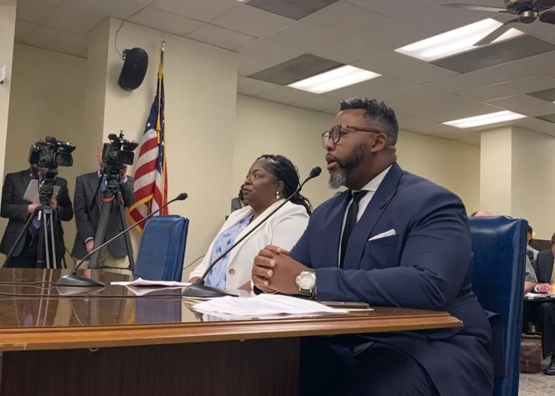 Rep. Kam Buckner, D-Chicago, right, presents a bill in the Illinois House Judiciary Criminal Committee alongside Anjanette Young