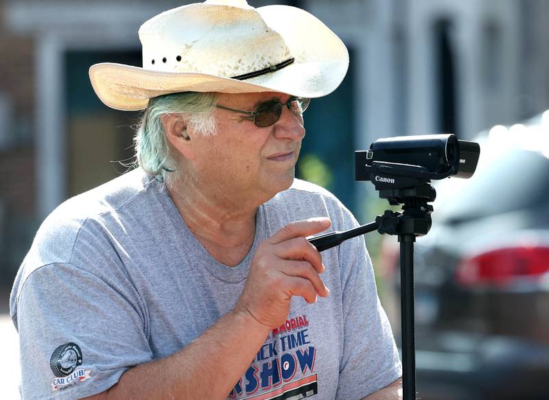 Mike Tritle, from DeKalb, shoots video Thursday, Aug. 22, 2024, during the DeKalb Veterans Memorial Mural dedication in Van Buer Plaza in DeKalb. Tritle captures the stories of veterans on video during at community events in the area.