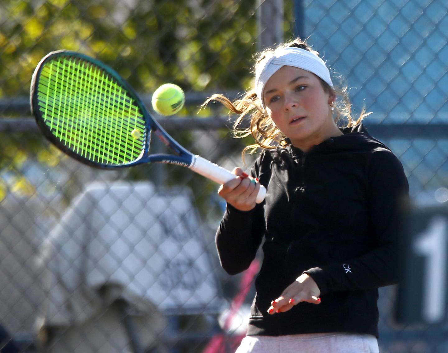 Marian Central’s Jenna Remke returns the ball Thursday, Oct. 23, 2025, during the first day of the IHSA State Girls Tennis Tournament at Hoffman Estates High School.