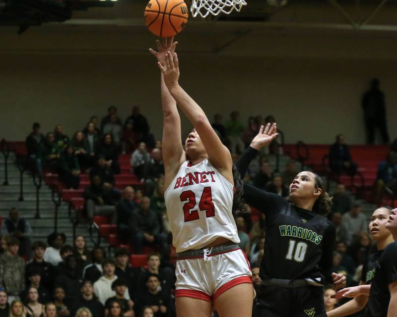 Benet's Emma Briggs (24) goes up for a lay up during their Class 4A Bolingbrook Sectional final basketball game between Waubonsie Valley at Benet. Feb 27, 2025 in Bolingbrook.