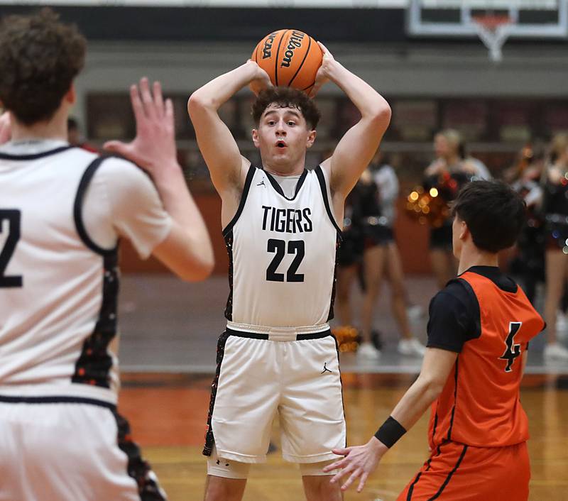 Crystal Lake Central's Johnny Geisser looks to pass as he is guarded by McHenry's Cole Tapia during a Fox Valley Conference boys basketball game on Tuesday, February. 10, 2026, at Crystal Lake Central High School.
