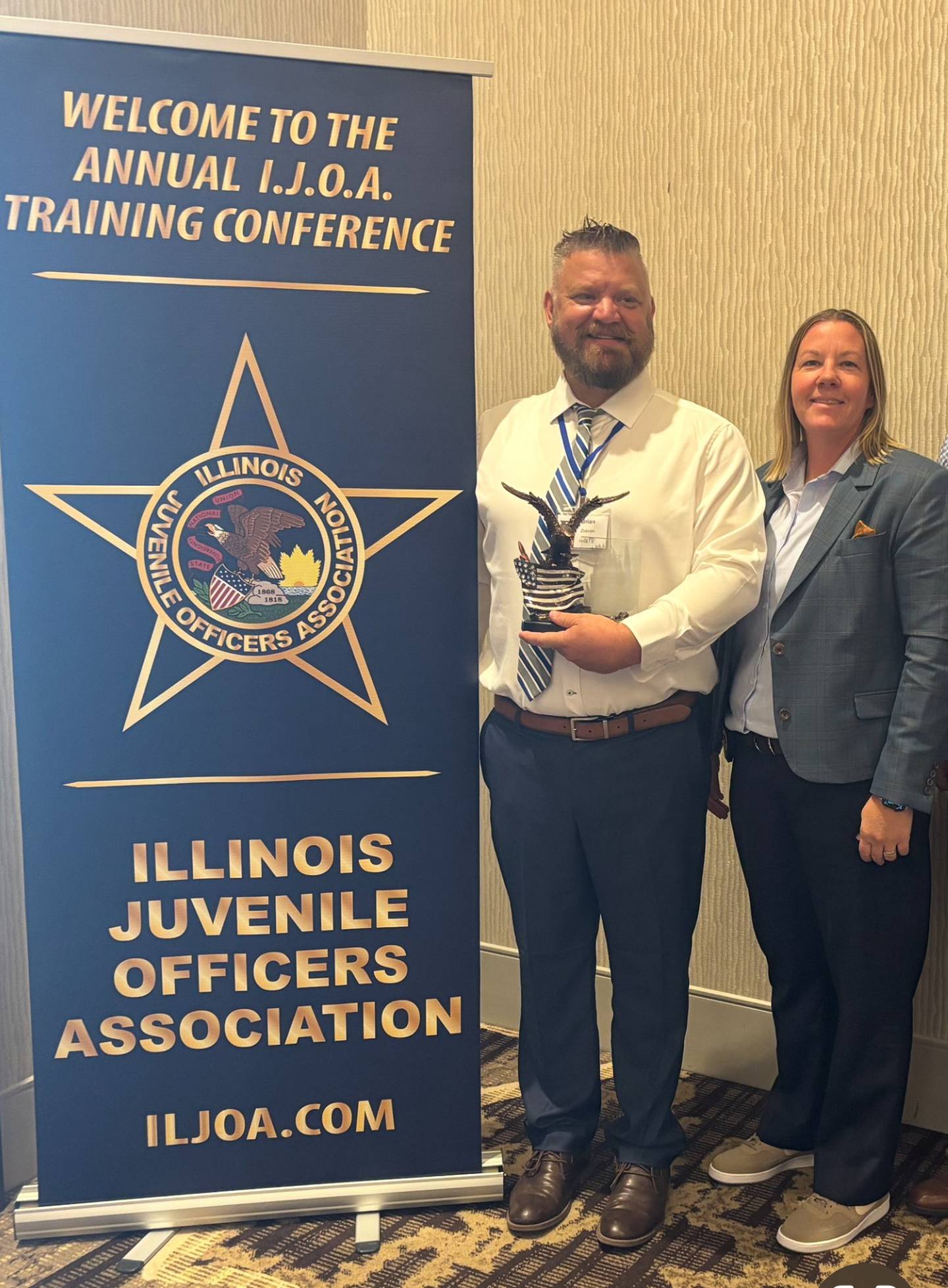 School Resource Officer Brian Zebron with Peru Police Chief Sarah Raymond after being presented the 2025 Illinois Juvenile Officer of the Year award on Wednesday, June 11, 2025.
