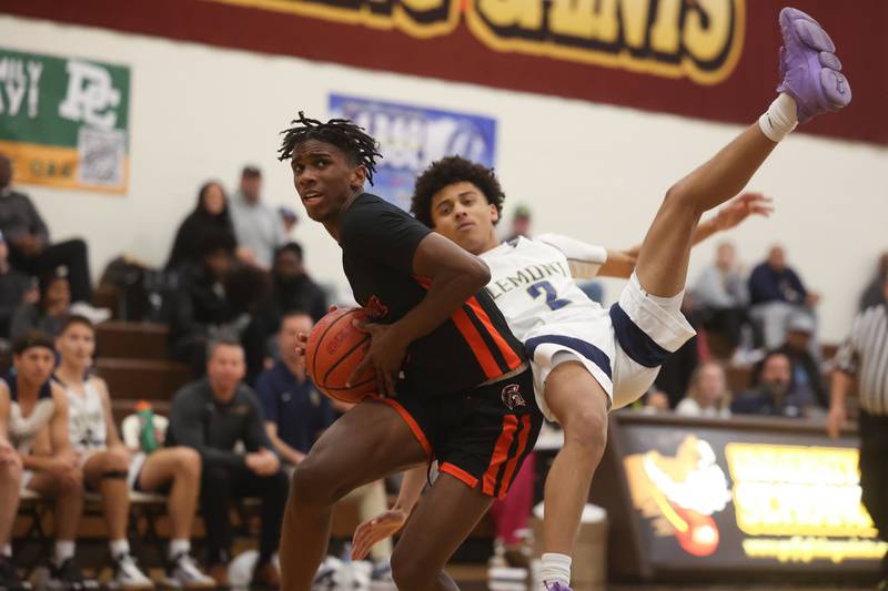 Romeoville’s Denonte Cunningham draws the foul against  Lemont in the WJOL Thanksgiving Classic Championship in Joliet on Saturday.