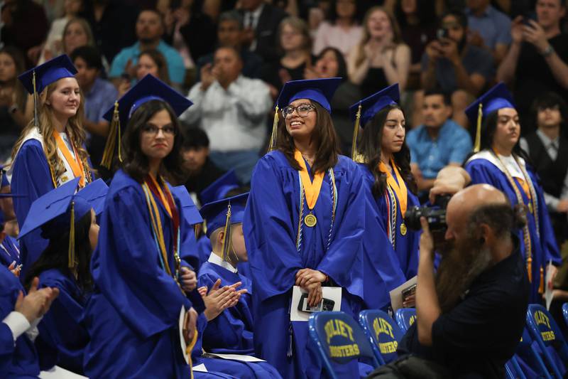 Several graduates stand in recognition at the Joliet Central Class of 2023 Commencement Ceremony on Saturday, May 20, 2023, in Joliet.