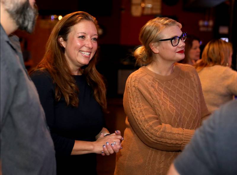 Kane County States Attorney Jamie Mosser (left), running for reelection against challenger Andrew Sosnowski, waits for election results with Kane County Undersheriff Amy Johnson (right) on Tuesday, Nov. 5, 2024 at Alibi in St. Charles.