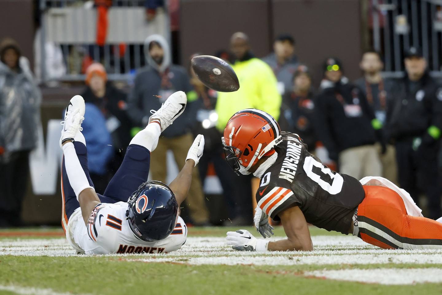 Cleveland Browns cornerback Greg Newsome II watches as Chicago Bears wide receiver Darnell Mooney looses control of a Hail Marry pass at the end of the game, Sunday, Dec. 17, 2023, in Cleveland.