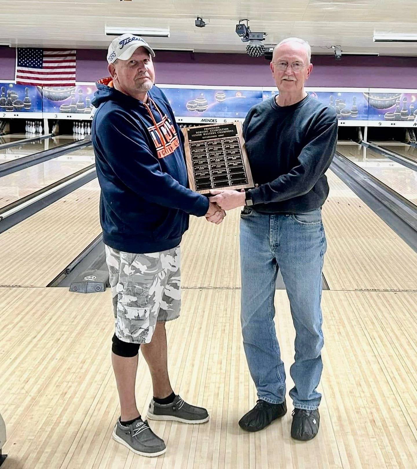 Princeton Bowling Association President Randy Allen (left) presents the Senior Masters plaque to 2025 champ Chuck Adams.