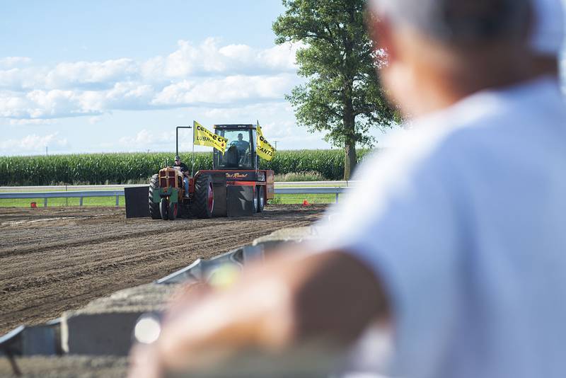 Dwight Frick starts the show Thursday, July 28, 2022 during the 4750 tractor class pulls at the Lee County 4H fair.