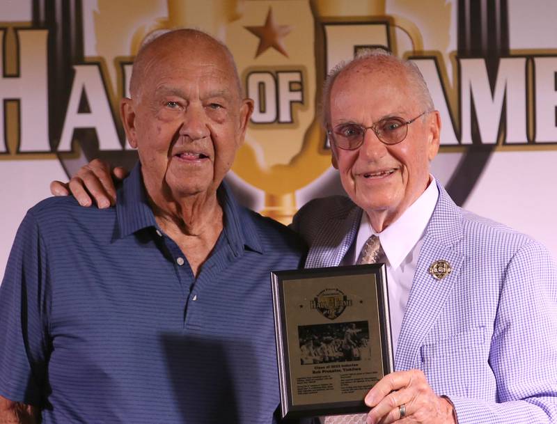 Bob Prusator, legendary basketball coach at Tiskilwa High School poses with his award presented by Lanny Slevin Emcee, during the Shaw Media Illinois Valley Sports Hall of Fame on Thursday, June 8, 2023 at the Auditorium Ballroom in La Salle.