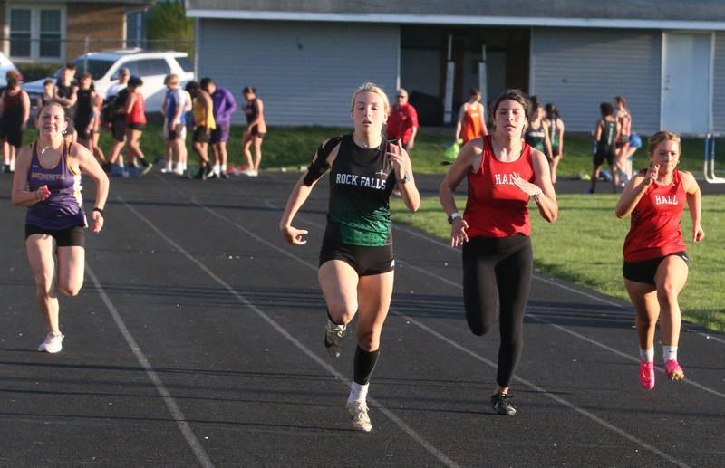 (From left) Mendota's Chloe Walzer, Rock Falls's Savannah Bufford, Hall's Keelie Cooper and Shanaya Grisham compete in the 100 meter dash during the Ferris Invitational on Monday, April 15, 2024 at Princeton High School.