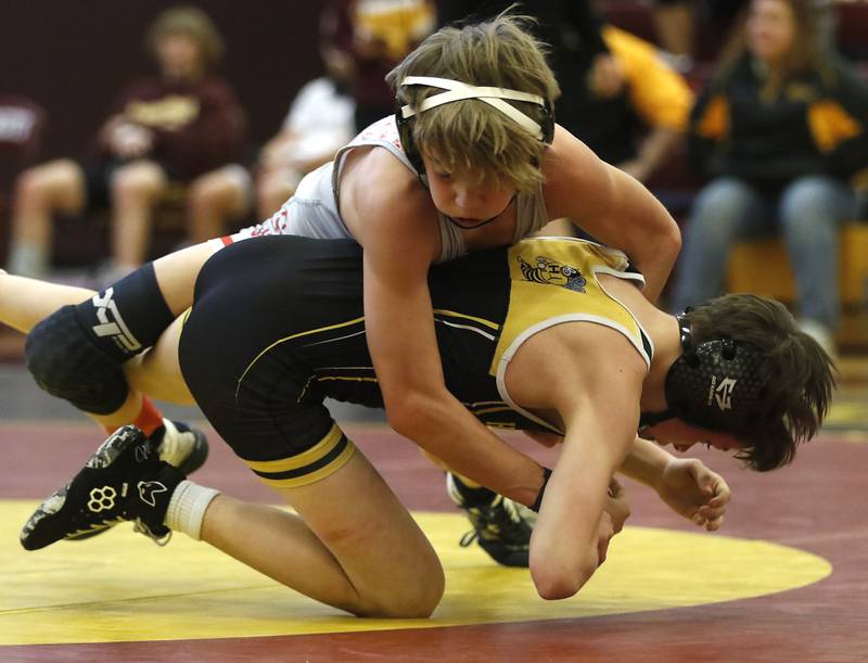 Marian Central Austin Hagevold takes down Harvard’s Owen Vail their 106-pound championship wrestling match in the IHSA 1A Richmond-Burton Wrestling Regional Thursday, Jan. 19, 2023, at Richmond-Burton High School in Richmond.