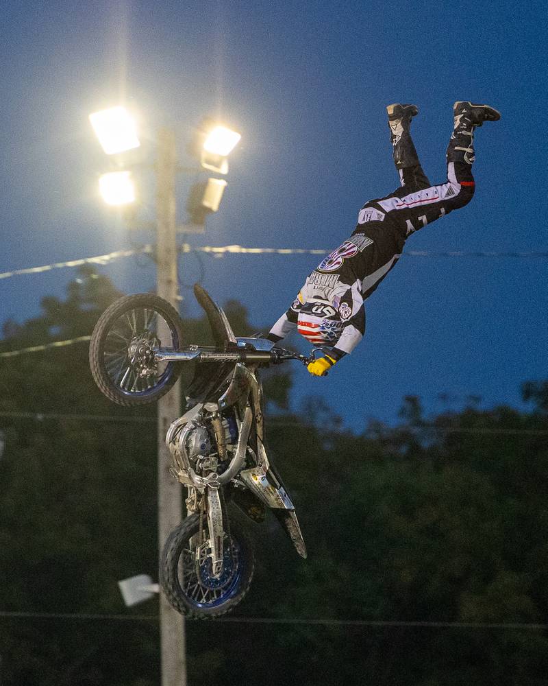 Scott Murray performs a 'Handstand' trick during the FMX segment of the Monster Truck Bash show on Saturday, Sept. 13, 2025 at the La Salle Speedway in La Salle.