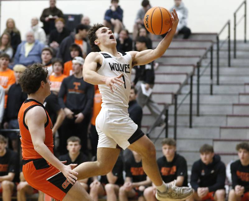 Prairie Ridge's Luke Vanderwiel drives to the basket against Crystal Lake Central's Johnny Geisser during an IHSA Class 3A Prairie Ridge Regional basketball game on Monday, Feb. 24, 2025, at Prairie Ridge High School.