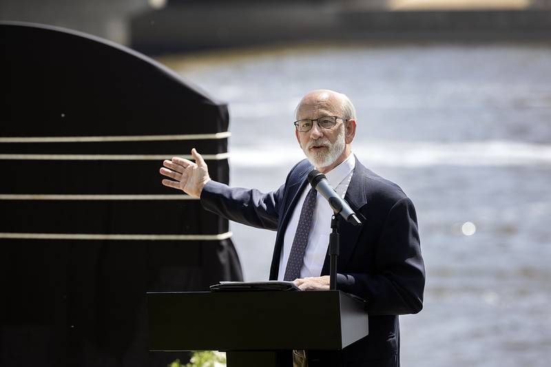 Tom Wadsworth, project team member for the Dixon Bridge Disaster landmark dedication, gestures Sunday, May 7, 2023 during the ceremony.