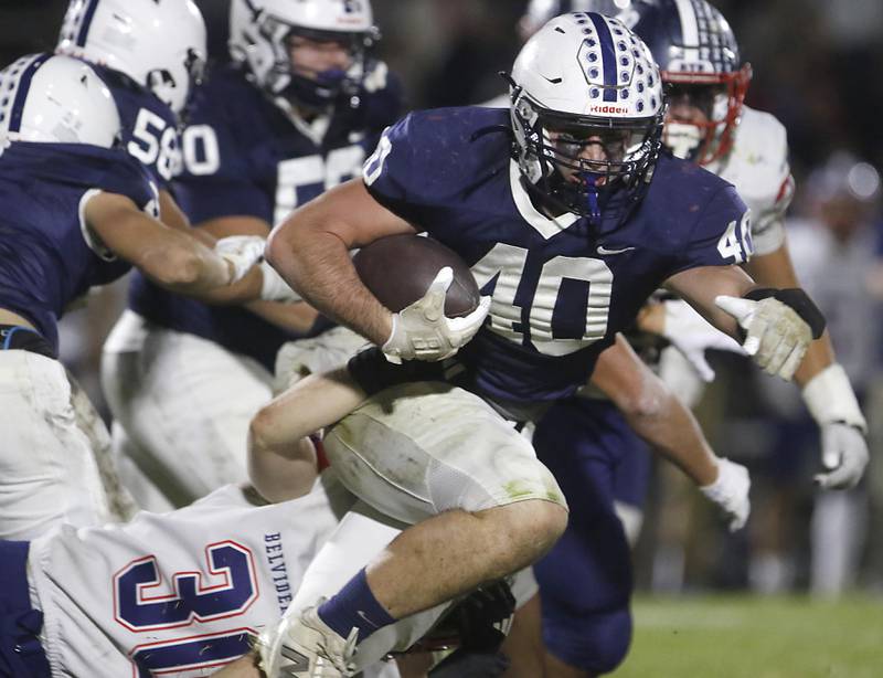 Cary-Grove's Logan Abrams runs with the football during an IHSA Class 5A quarterfinal playoff football game against Belvidere North on Friday, November 14, 2025, at Cary-Grove High School, in Cary.