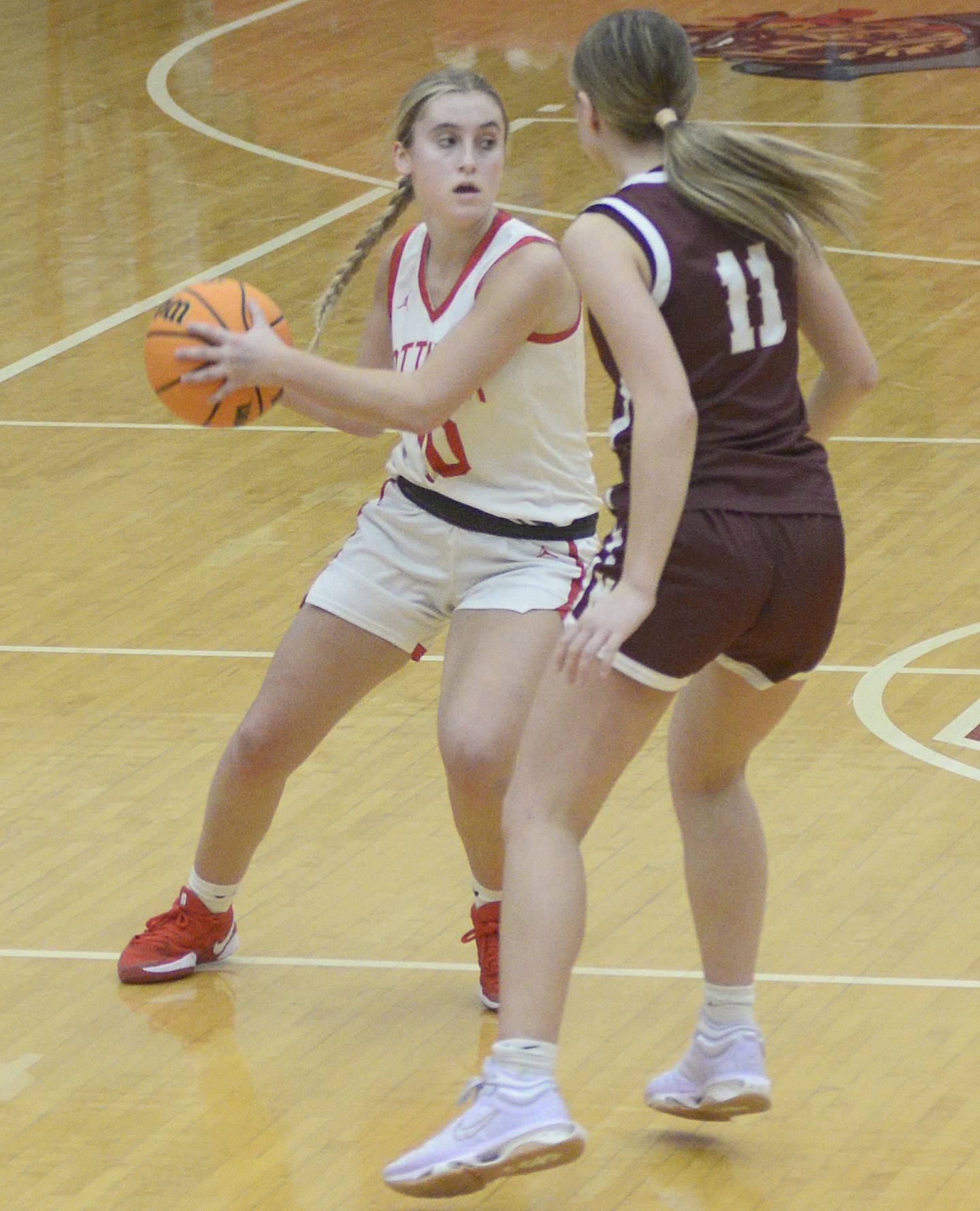 Ottawa’s Ella Schmitz tries to get a pass around Morris’s Alyssa Jepson in the fourth period Saturday at Ottawa.