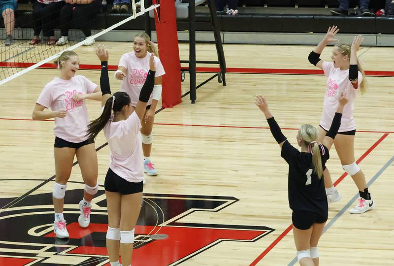 Panther teammates Lauren Abbott, Wynne Renkes, Shelby Hodgett, Ashlyn Johnson, and Brynn Brown celebrate winning the game point during the first set against the Hall Red Devils Tuesday, Oct. 7, 2025, in Prophetstown. They would go on to take the 2nd set as well, leaving the Panthers undefeated in conference games this season.