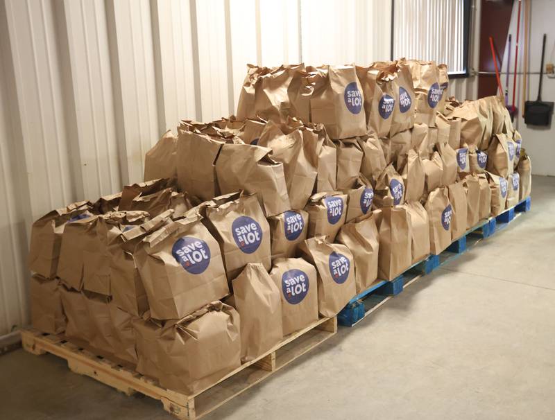 Nearly 100 grocery bags full of food wait to be handed out during the Easter distribution on Wednesday, March 25, 2026 at the Illinois Valley Food Pantry in Peru.