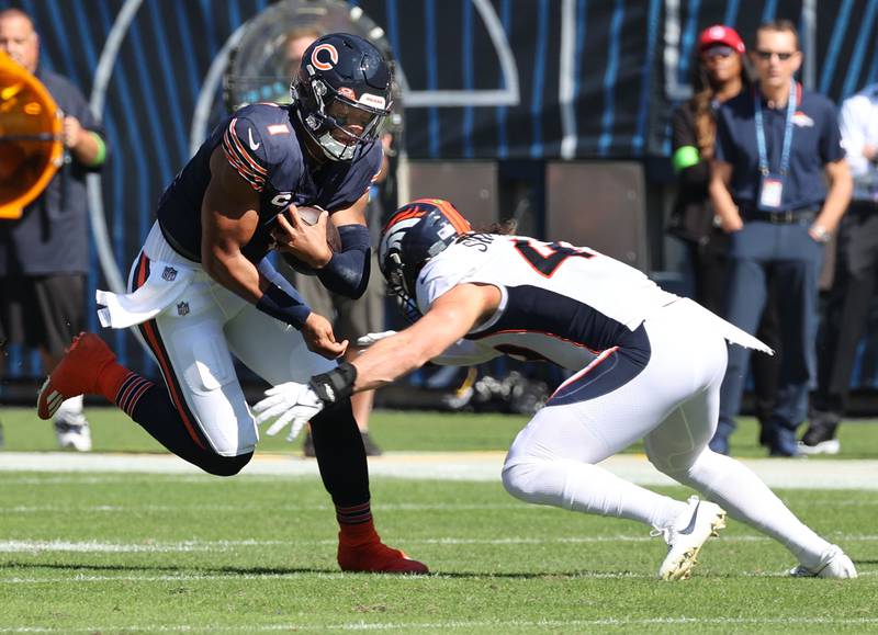 Chicago Bears quarterback Justin Fields scrambles for yardage during their game against the Denver Broncos Sunday, Oct. 1, 2023, at Soldier Field in Chicago.