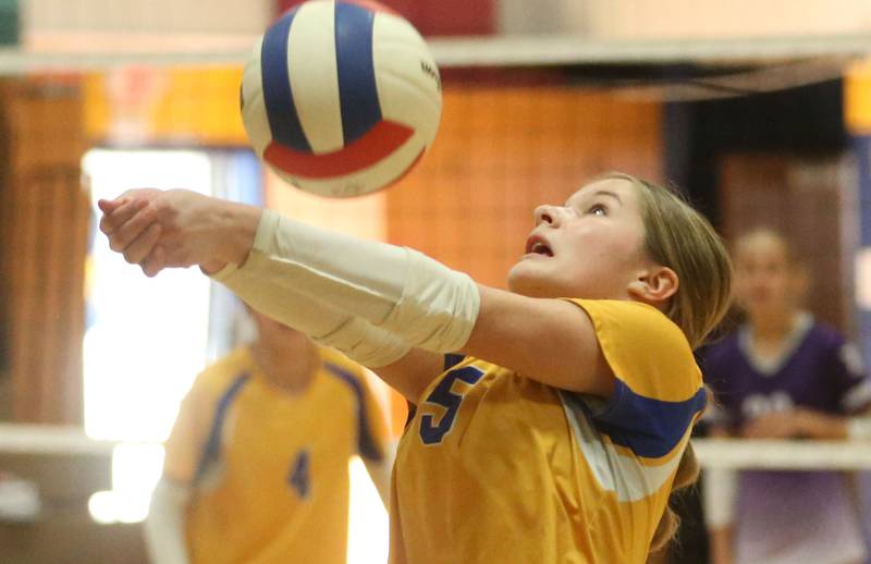 Logan's Collyns Etheridge returns a serve from Rockford-Marshall during the IESA Class 3A eighth-grade Regional final game on Thursday, March 13, 2025 at Logan Junior High School in Princeton.