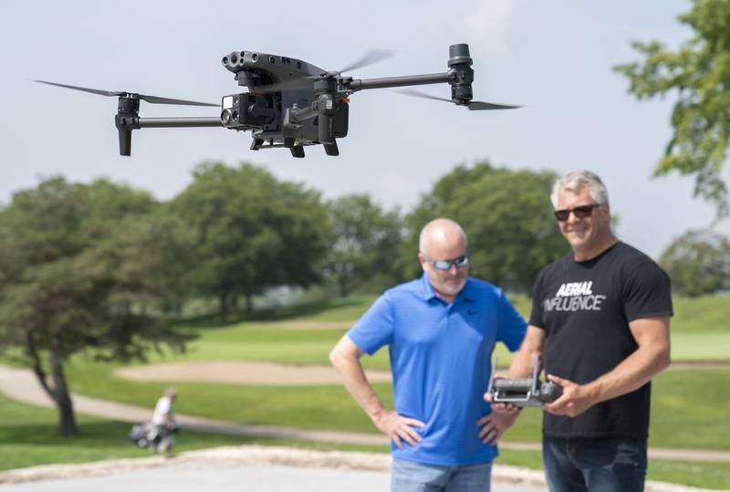 Village of Lakewood Police Sgt. Sean McGrath, left, receives training on the police department's new DJI Matrice M30T drone by Michael Ferguson of Aerial Influence on Friday, Aug. 18, 2023, at RedTail Golf Club in Lakewood.