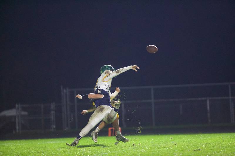 Crystal Lake South's Caden Casimino makes a throw as Cary - Grove's Charles Ciske goes for the tackle on Friday, Oct. 13 2023 in Cary Grove.