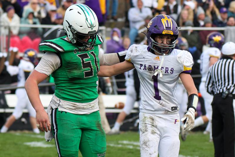 Graham Meister of Dwight/Gardner-South Wilmington hugs Jerrett Fauser of Farmington on Saturday, November 16, 2024 at Dwight High School in Dwight.