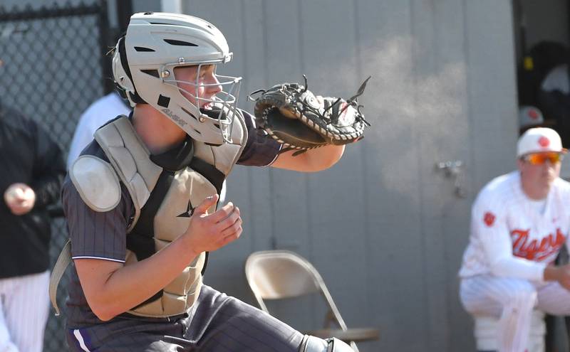 Dixon's Brady Feit looks the runner back as he catches a pitch against Byron during a Big Northern Conference game in Byron on Monday, May 11, 2026.