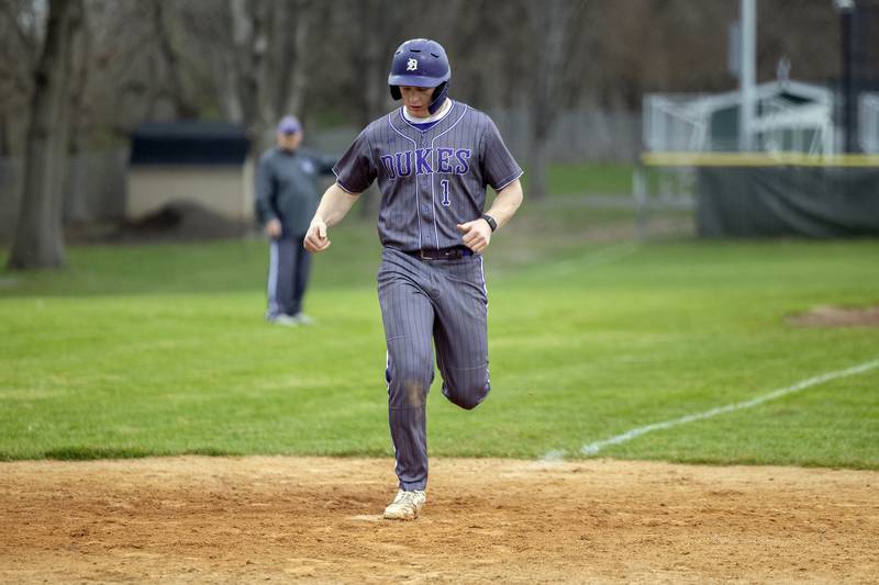 Dixon’s Jake Whelan comes in to score on a wild pitch against Rock Falls Thursday, April 9, 2026.