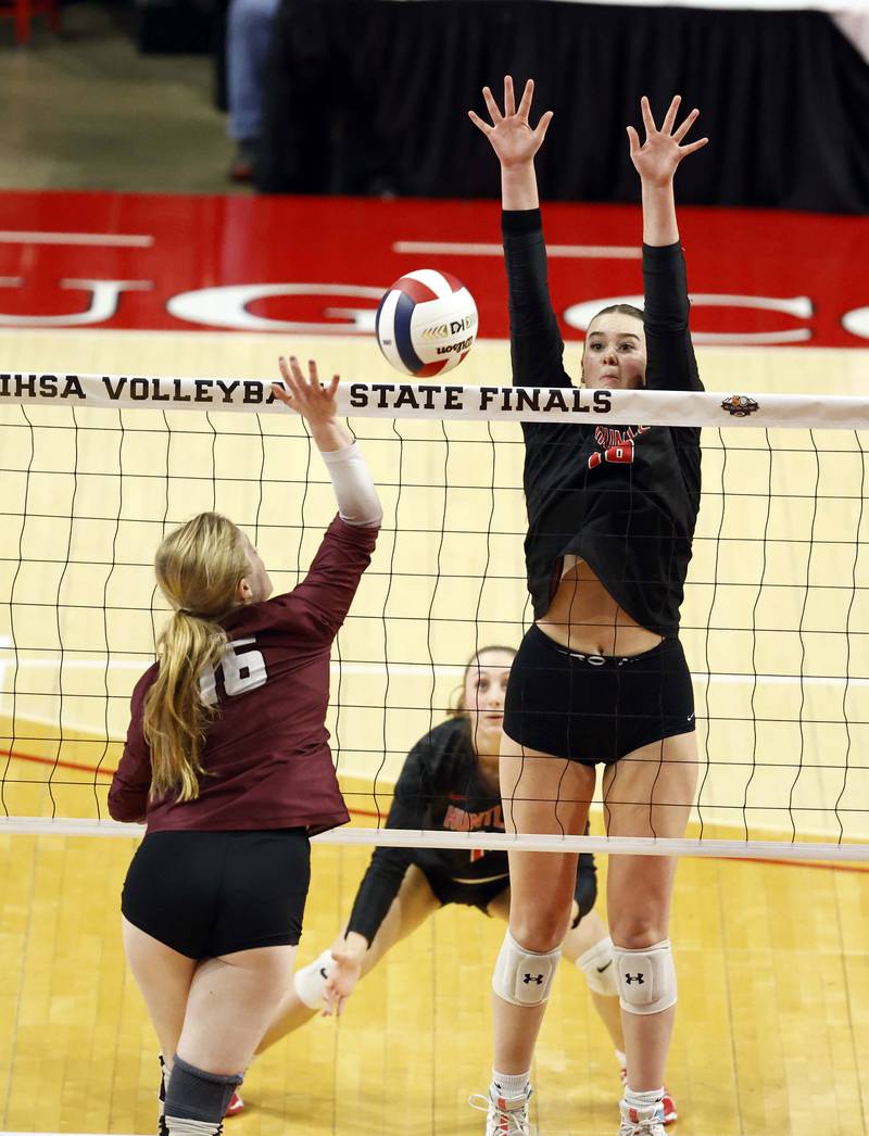 Lockport's Quinn Higham (16) tries to push the ball past Huntley's Georgia Watson (16) during the IHSA Class 4A girls volleyball third place match Saturday, Nov. 16, 2024 at CEFCU Arena in Normal.