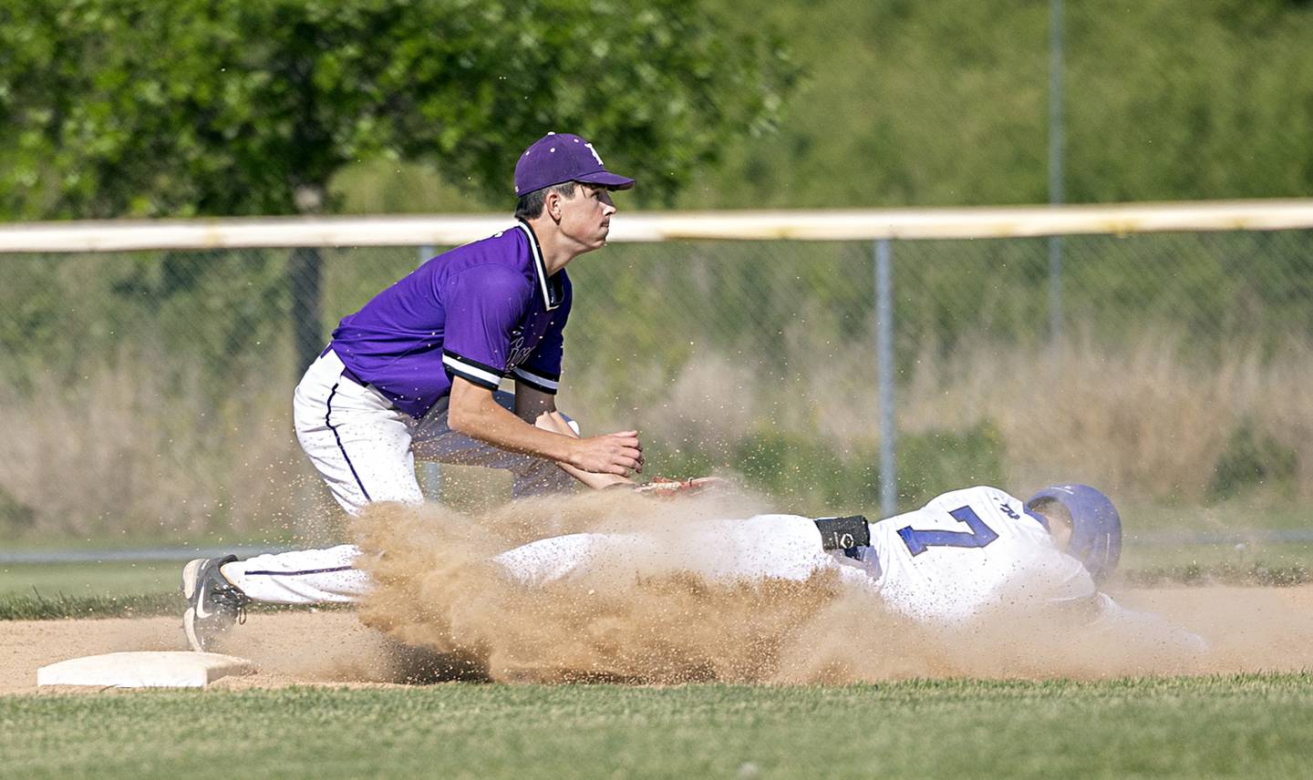 Burlington Centrals’ Brady Gilroy slides in safely at second as Dixon’s Alex Harrison fields the throw Thursday, May 25, 2023 during a class 3A regional semifinal in Rochelle.