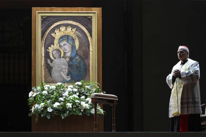 FILE - Cardinal Robert Francis Prevost, Prefect of the Dicastery for Bishops, leads the recitation of the Holy Rosary for Pope Francis' health in St Peter's Square at the Vatican, March 3, 2025. (AP Photo/Kirsty Wigglesworth, File)