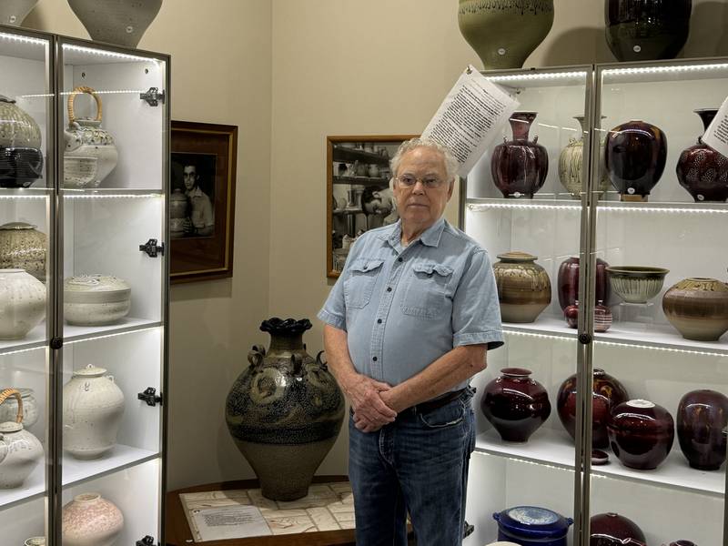 Tom Turner with his pottery exhibit at the Grundy County Historical Society Museum.