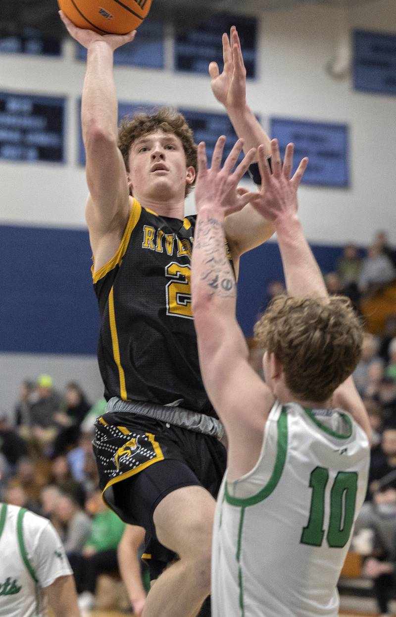 Riverdale’s Jacob Watson puts up a shot  against Rock Falls’ Kuitim Heald Friday, Feb. 28, 2025, during the Class 2A Regional final at Bureau Valley High School.
