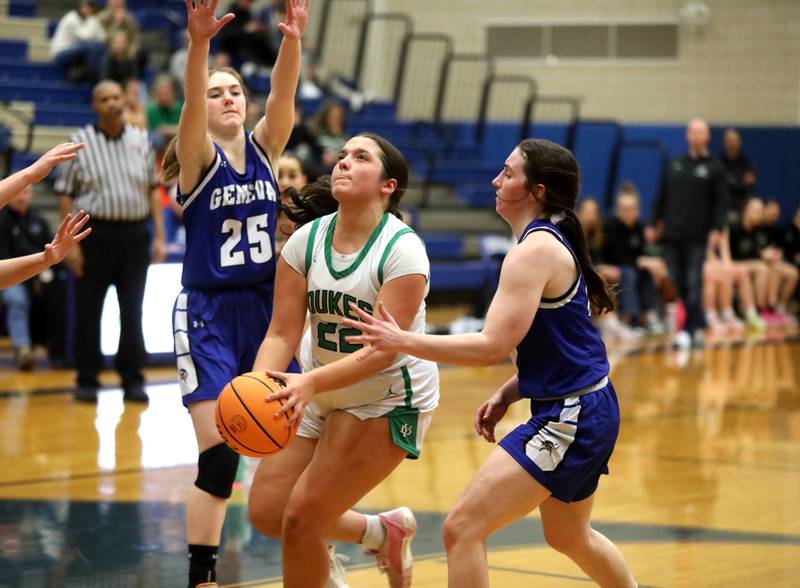 York’s Amelie Van heukelum attempts a shot from under the basket between Geneva's Bridget Hecker and Geneva's Gabby Webb during a 4A Geneva Regional semifinal game on Tuesday, Feb. 18, 2025 in Geneva.