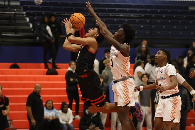 Bolingbrook's Brady Pettigrew gets the basket and the foul against Romeoville on Tuesday, Dec. 2, 2025 in Romeoville.