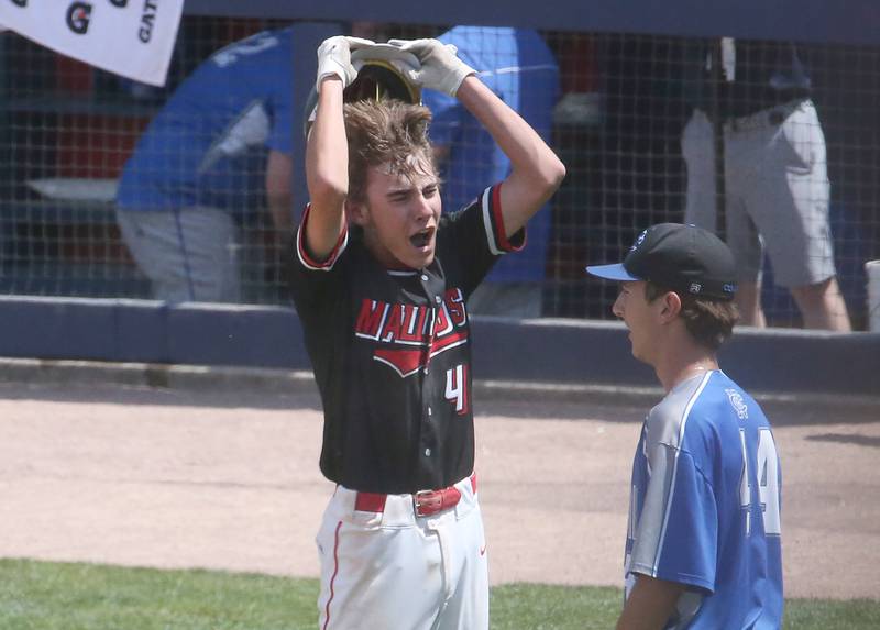 Henry-Senachwine's Carson Rowe reacts in front of Newman pitcher Kyle Wolfe after scoring the game winning run during the Class 1A State semifinal game on Friday, June 2, 2023 at Dozer Park in Peoria.