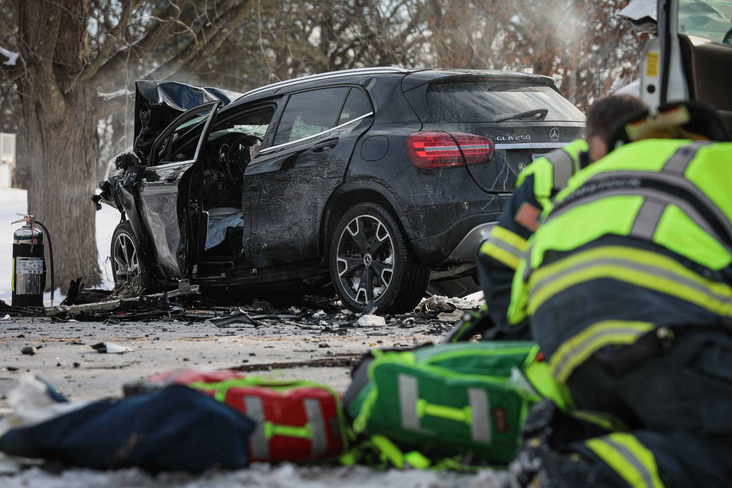 First responders work the scene of a crash on Sunday, Feb. 16, 2025, on Route 14 in Woodstock where one person died and five others were injured.