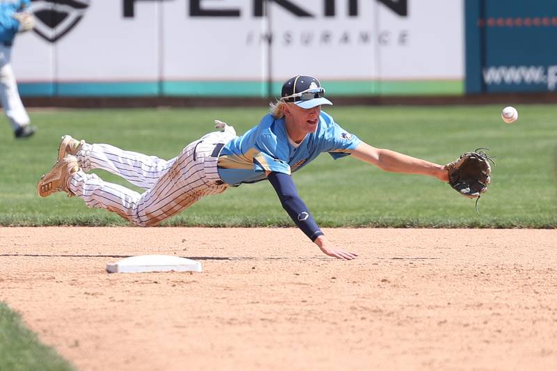 Marquette’s Logan Nelson dives for a ground ball against Leroy in the IHSA Class 1A 3rd place game. Saturday, June 4, 2022 in Peoria.