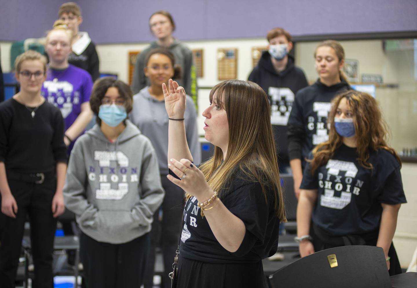 Dixon High School choir teacher Erin Rogers runs her group through voice work during class Thursday, April 14, 2022.