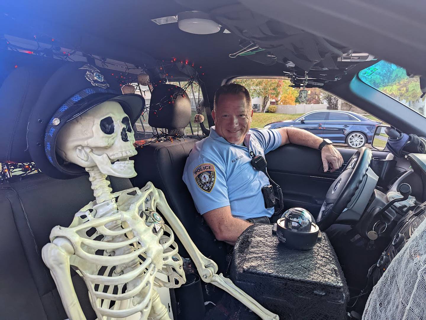 The Joliet Police Department provides security during public viewing hours of the "Stranger Things" exhibit at the Plainfield on Dave Appel and Aubrey Appel. On Saturday, Oct. 29, 2022, Joliet police officer Robert Klancher had extra help from his silent partner Officer Creaky Bones.