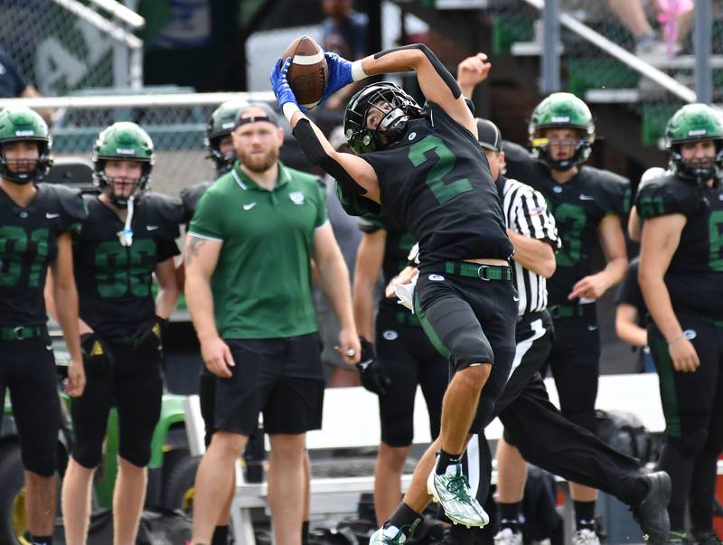 Glenbard West's Aidan Murphy (2) makes a catch near the sideline for a big gain during a game on Aug. 26, 2023 at Glenbard West High School in Glen Ellyn.