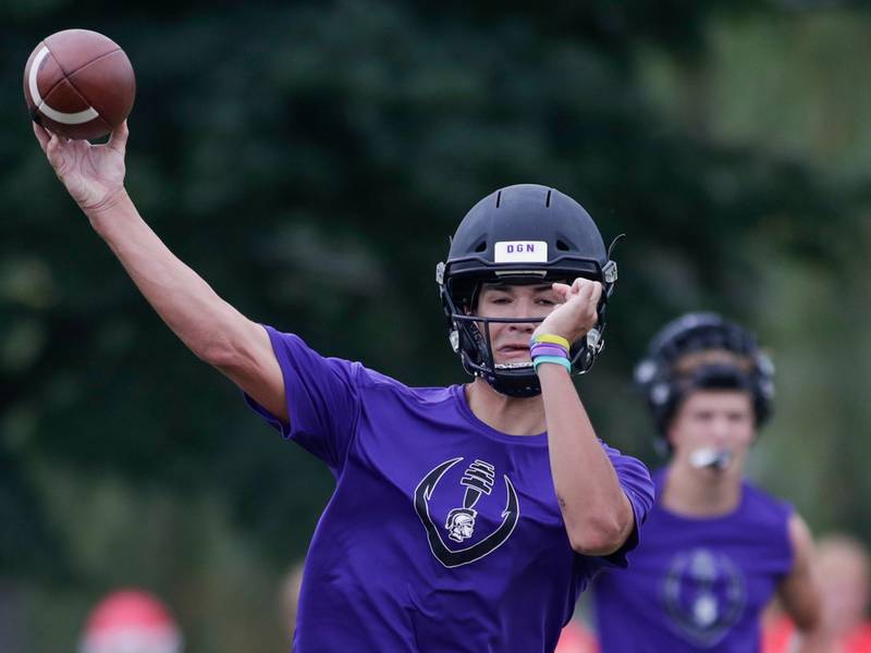 Downers Grove North’s Sam Reichert passes the ball during the Downers Grove South 7-on-7 in Downers Grove on Saturday, July 16, 2022.