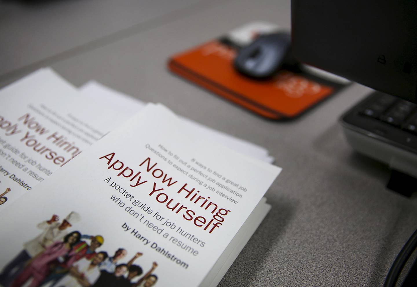 A pamphlet with job hunting information sits at a computer station Thursday at the Workforce Investment Board of Will County's location in Joliet.