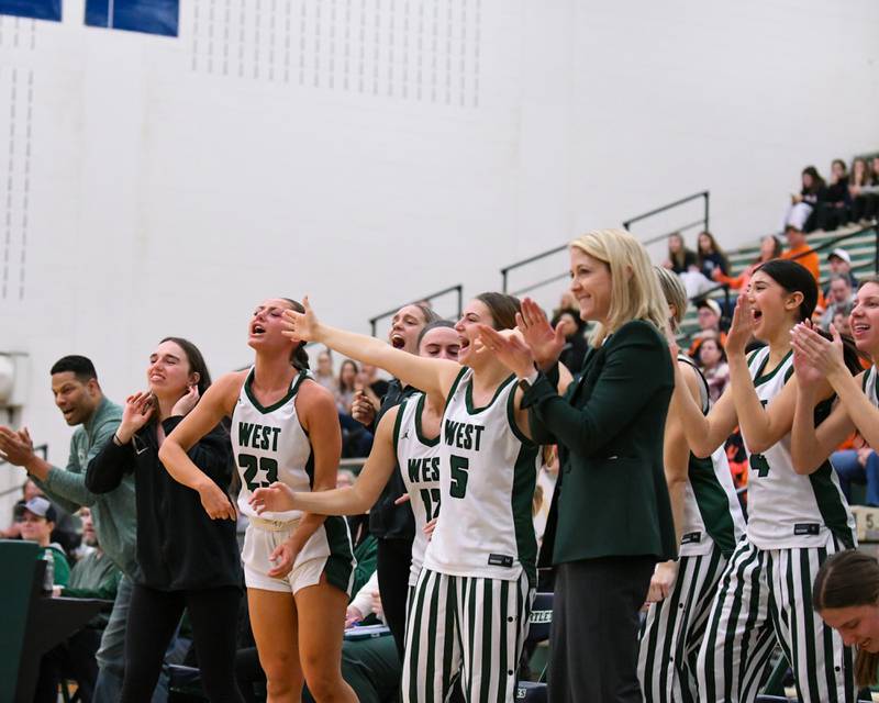 Glenbard West’s bench celebrates after a foul was called against St. Charles East on Thursday Feb. 26, 2026, during the 4A Sectional championship game held at Bartlett High School,