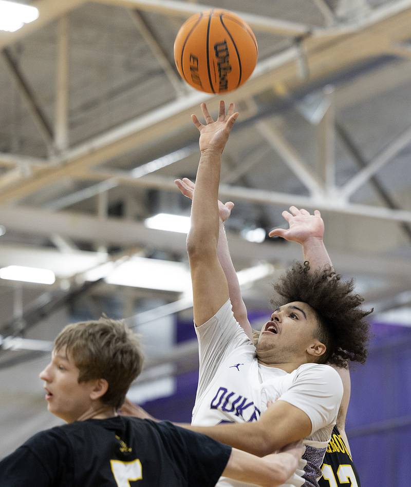 Dixon’s Darius Harrington works below the basket against Elk Grove Saturday, Jan. 11, 2025, at Dixon High School.